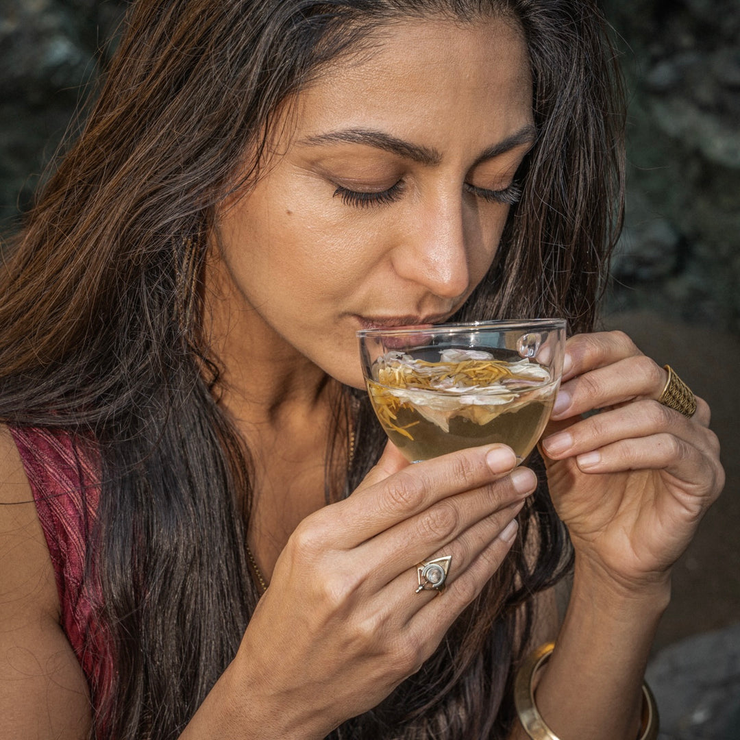 Goddess sipping on Nelumbi Blue Lotus Flower in Teacup
