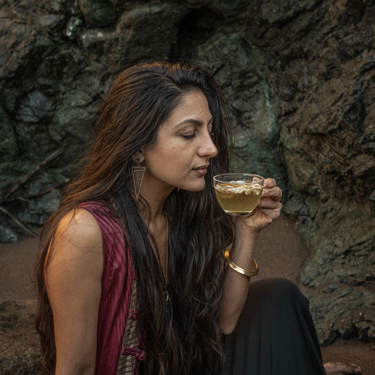 Goddess smelling Goddess sipping on Nelumbi Blue Lotus Flower in Teacup
